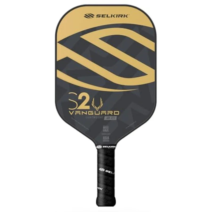 A Selkirk S2 Vanguard pickleball paddle featuring a black and gold geometric design on the face, with a black wrapped handle, shown against a plain white background.